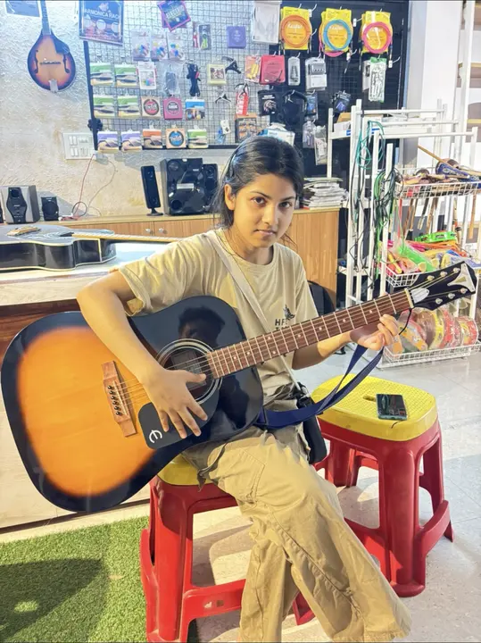 Happy customer with acoustic guitar